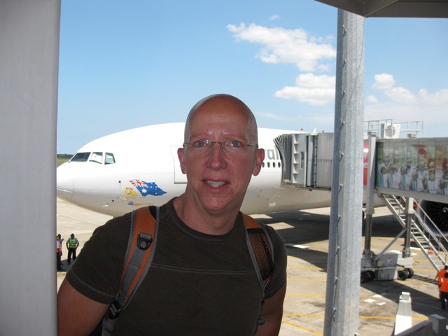 Tom in front of plane in Fiji
